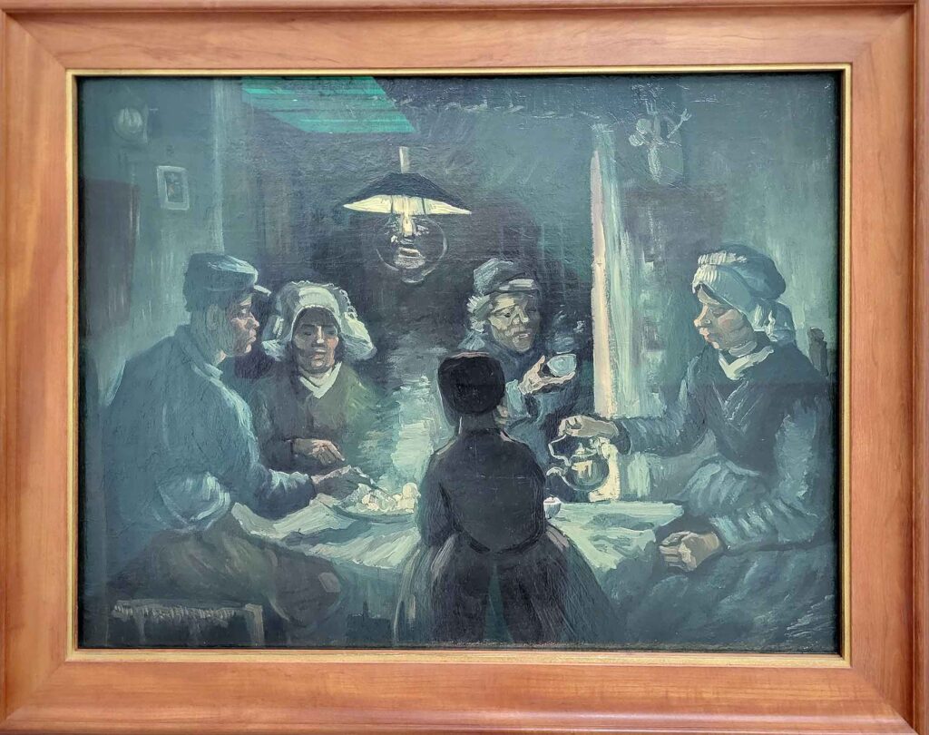 Gemälde „Die Kartoffelesser“ von Vincent van Gogh mit fünf Personen an einem Tisch in dunkler, bäuerlicher Atmosphäre